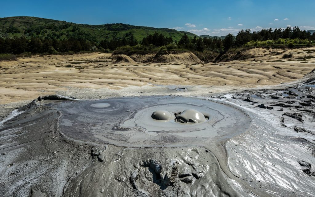 Some of the most unique places to see in Romania are the muddy volcanoes