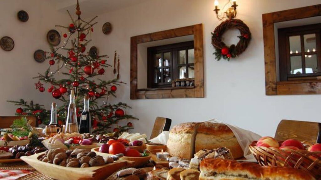 Traditional Romanian food for Christmas next to the Christmas tree