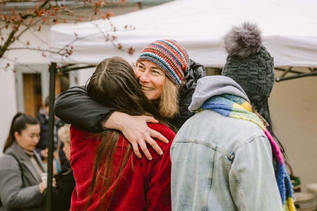 People hugging during travel to Romania